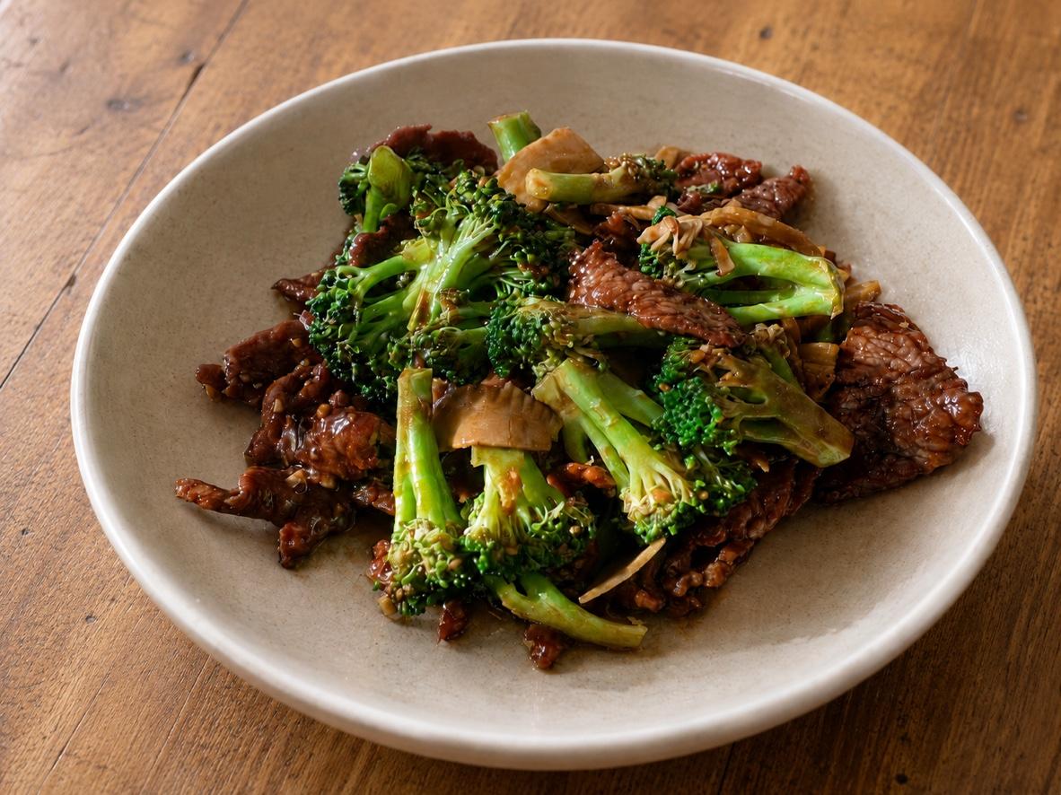 Homemade beef and broccoli stir-fry with bamboo shoots in a glossy brown garlic sauce