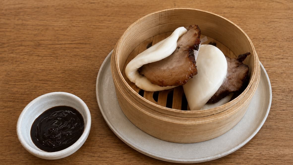 Steamed char siu bao buns filled with glazed Chinese BBQ pork and served with hoisin dipping sauce.