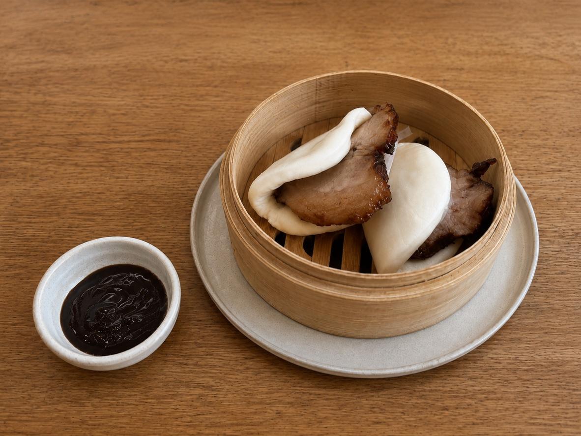 Steamed char siu bao buns filled with glazed Chinese BBQ pork and served with hoisin dipping sauce.