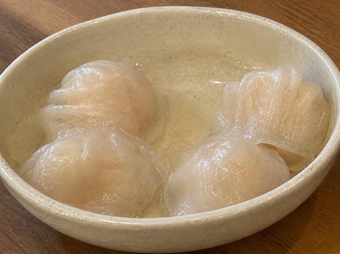 Translucent Cantonese har gow shrimp dumplings on a ceramic plate