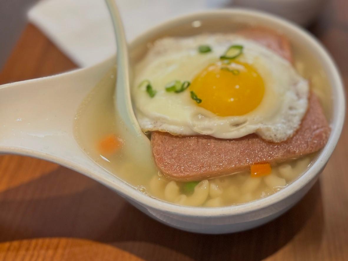 Hong Kong-style macaroni soup topped with luncheon meat, a fried egg, and scallions