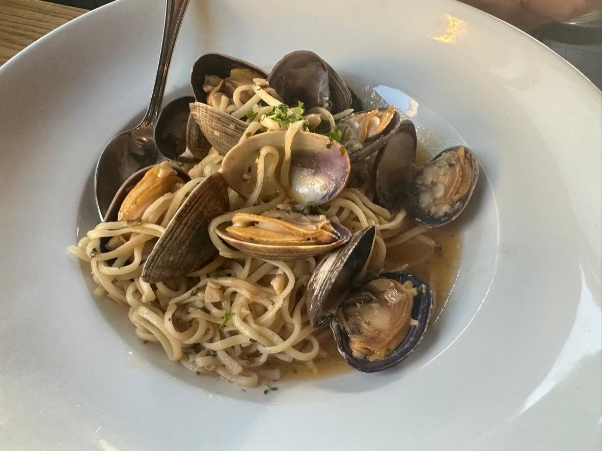 Linguine with opened clams in a garlic white wine sauce with parsley