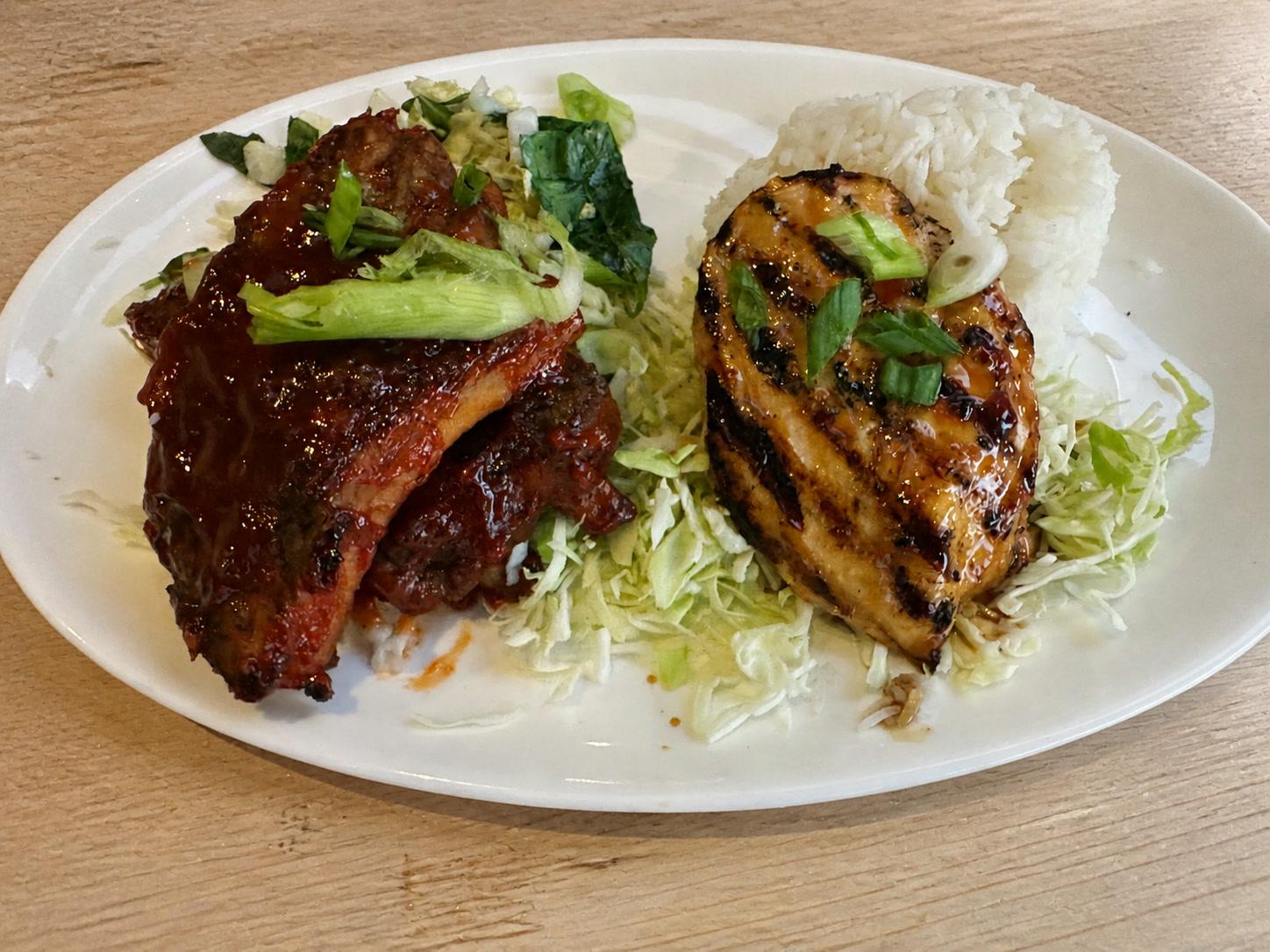 Mango barbecue pork ribs and grilled huli huli chicken with jasmine rice and cabbage slaw
