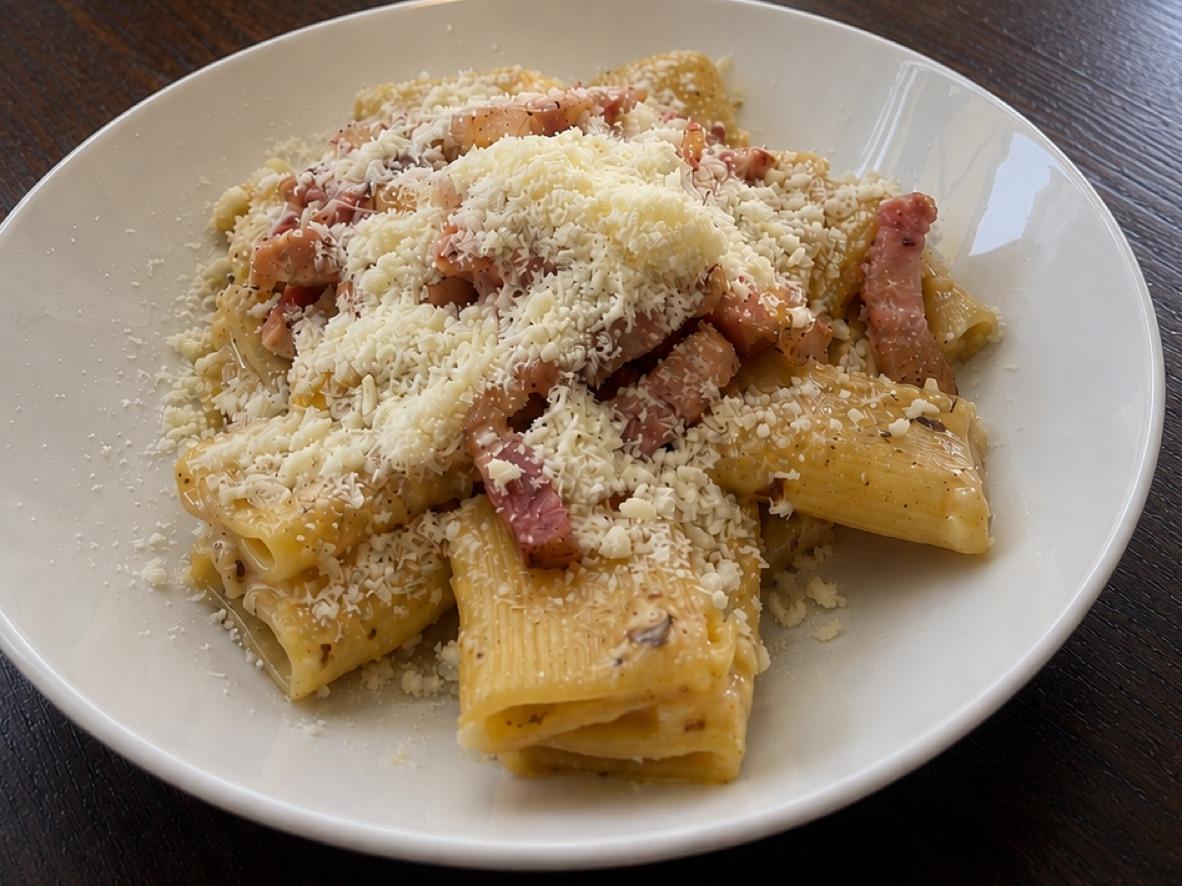 Mezzi paccheri carbonara with guanciale, black pepper, and grated Pecorino