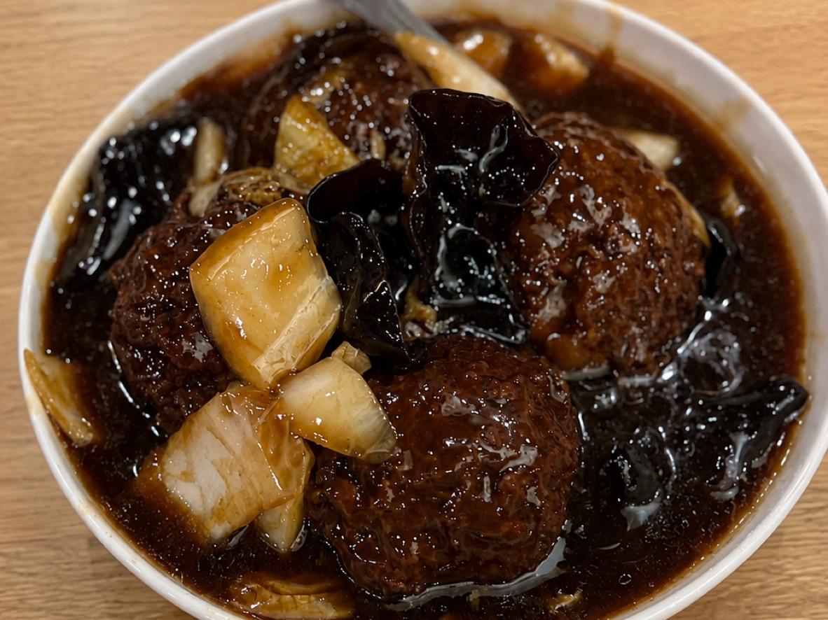 Red-braised Lion’s Head meatballs with bok choy in dark soy sauce