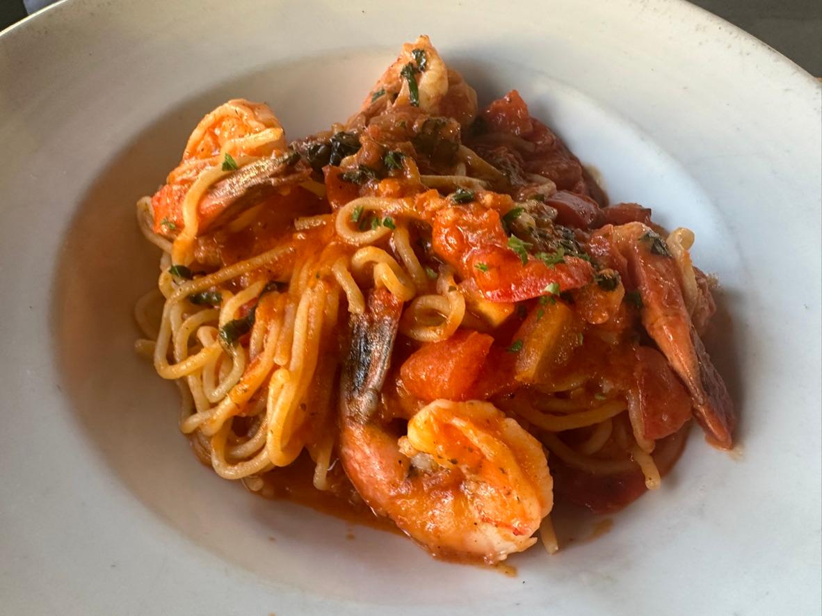 Spaghetti with shrimp, mussels, clams, and calamari in spicy tomato sauce