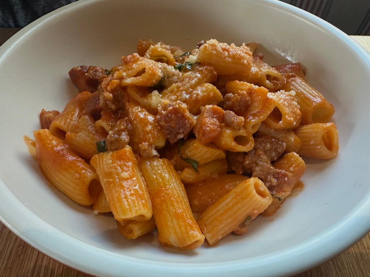 Spicy rigatoni with sausage and pancetta in tomato cream sauce