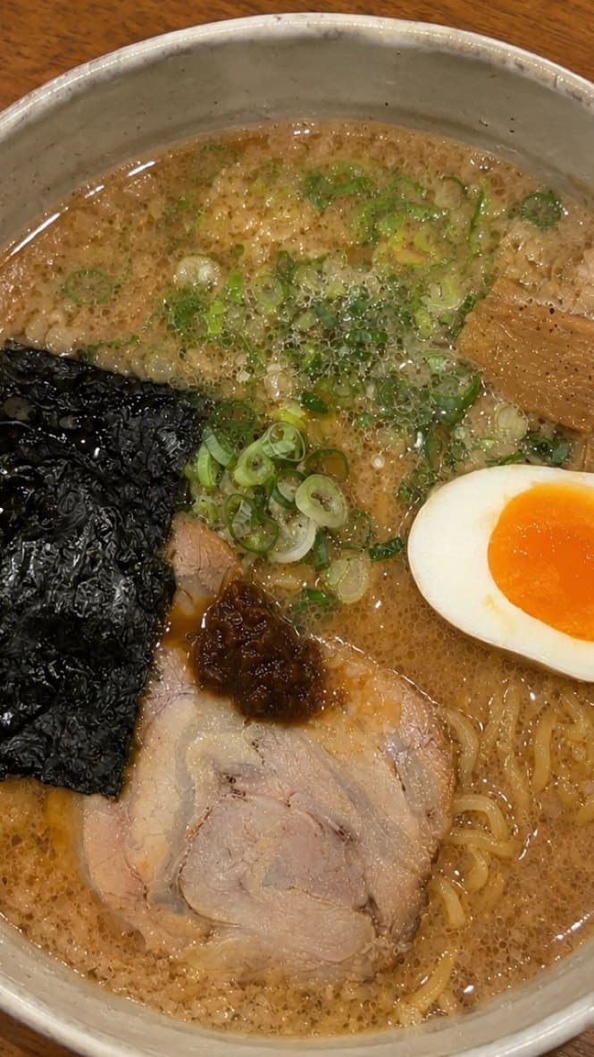 TikTok-style video still of a tonkotsu ramen bowl